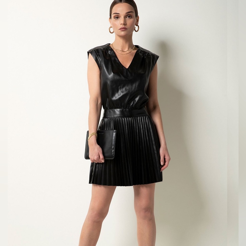 Tart size large leather dress. Perfect for events! In perfect condition.